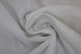 Swirled swatch white sheer fabric with subtle cross hatch effect