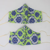 Front and back view of ninja style mask with off white elastic ear loops (bright green mask with blue and off white damask style floral pattern)