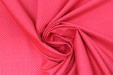 Swirled swatch so ruby fabric (bright cherry red fabric with tiny faint red dots allover)