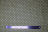 Flat swatch Matcha Dots fabric (pale green fabric with small white polka dots allover)