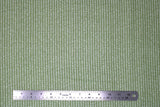 Flat swatch farmhouse themed printed fabric in White Cursive on Green
