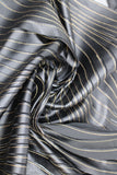 Swirled swatch of faux leather striped netting (black)