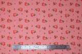 Flat swatch summer blush fabric (pink/coral fabric with tossed red and white small floral with green stems)