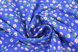 Swirled swatch daisies blue fabric (royal blue fabric with small tossed white daisies allover with dark orange centers and tiny green stems)