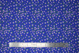 Flat swatch daisies blue fabric (royal blue fabric with small tossed white daisies allover with dark orange centers and tiny green stems)