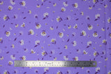 Flat swatch lilies and dandelions purple fabric (pale purple fabric with tossed white and purple small lilies and dandelions allover)