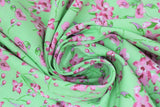 Swirled swatch tulips and lilies green fabric (bright lime green fabric with medium sized tossed white and pink tulips and lilies allover with green stems)