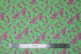 Flat swatch tulips and lilies green fabric (bright lime green fabric with medium sized tossed white and pink tulips and lilies allover with green stems)