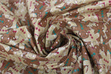 Swirled swatch Stacked fabric (busy collaged light and dark beige/brown gingerbread cookie printed fabric allover cartoon style with smiling faces and red and green buttons)