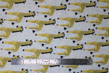 Flat swatch giraffes fabric (white fabric with mint polka dots and repeated illustrative style yellow and brown giraffes)