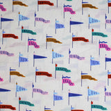 Square swatch Green Flags fabric (white fabric with loosely spaced blue post drawn flags with various coloured sails/flags: blue, green, pink, red, purple, etc. with words such as "Love" "Bravery" "Compassion" etc on them)