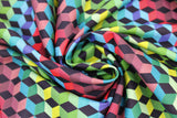 Swirled swatch 3D Blocks fabric (3D cubes allover with coloured faces in green, blue, red, ombre style stripes with black faces on one side)