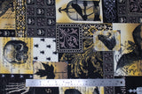 Flat swatch halloween printed fabric in Spooky Collage (white, yellow, black colours skulls, birds, spooky patches)