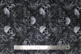 Flat swatch halloween printed fabric in Tossed Skulls on Paisley (white and black skulls and paisley mix)