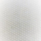 Swatch of white fabric with regular rows of tiny white latex dots.