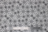 Flat swatch flowers fabric (white fabric with large black floral head outlines allover)