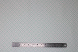 Flat swatch bee backgrounds fabric (white fabric with teal grid lines solid squares with 4 squares within separated by dotted line, each square with a tiny dot in the center)