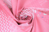 Swirled swatch someday fabric (bubblegum pink fabric comprised of square and rectangle labels/patches with different styles, some floral, stripes with white, chevron, triangles, etc.)