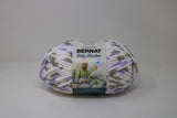 Ball of Bernat Baby Blanket in shade Little Lilac Dove (white, purple, taupe)