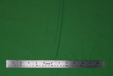 Flat swatch of cotton solid in green medium