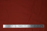 Flat swatch of cotton solid in light rust