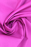 Swirled swatch of cotton solid in fuchsia