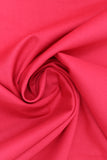 Swirled swatch of cotton solid in claret (red)