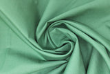 Swirled swatch of cotton solid in forest