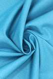 Swirled swatch of cotton solid in green turquoise