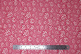 Flat swatch of peony printed fabric in pink (medium pink fabric with light pink cartoon peony heads tossed)
