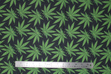 Flat swatch of pot leaf print fabric on black