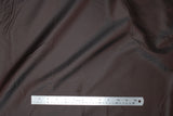 Flat swatch of polyester lining in dark brown