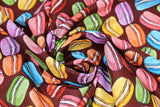 Swirled swatch macaroon fabric (burgundy fabric with tossed illustrative style macaron cookies with white icing in the center in blue, orange, pink, purple, yellow, green, brown, etc.)