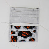 Front and back view of mask with white elastic ear loops (pale grey mask with white crescent moons design)