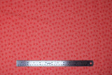 Flat swatch Orange Bees fabric (pale orange fabric with dark orange bee silhouettes allover)