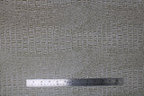 Flat swatch gator textured vinyl in palomino (white/pale brown)
