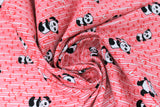 Swirled swatch pink bamboo fabric (pale baby pink fabric with pink bamboo chutes allover and scattered cartoon pandas in various sizes/poses)