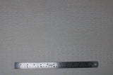 Flat swatch pearl coloured gator style textured vinyl fabric