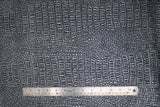 Flat swatch brass coloured gator style textured vinyl fabric