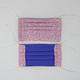 Front and back view of mask with white elastic ear loops (pale pink mask with medium pink tiny camo look design allover)