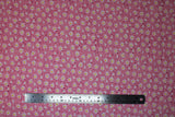 Flat swatch Pink Daisies fabric (small tossed pink daisy floral heads allover with medium sized white daisy heads with yellow centers)