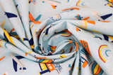 Swirled swatch Planes and Boats fabric (light blue fabric with tossed full colour drawn style planes, boats, hot air balloons, rainbows, etc.)