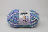 Ball of Bernat Baby Blanket in shade Posy Purple (purple, green, indigo)