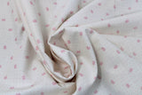 Swirled swatch tiny florals fabric in white with flowers
