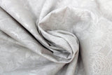 Swirled swatch flower & plant print fabric in bees & hummingbirds (white on grey)