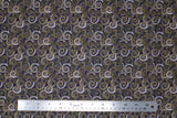 Flat swatch Swirls & Clouds printed fabric in way under (spirals on dark blue)