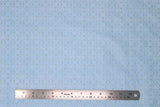 Flat swatch tiled print fabric in light blue
