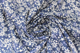 Swirled swatch floral fabric (navy fabric with busy white and light blue floral allover on long stems throughout)