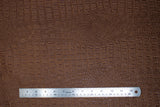 Flat swatch gator textured vinyl in saddle (medium warm brown)