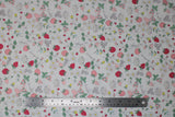 Flat swatch berries fabric (white fabric with small tossed pink and red strawberries and generic berry shapes, tossed white and yellow floral, tossed greenery and outlines)